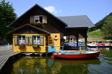 Lunz am See, Austria, colourful home and boats on lake Lunzerseeのeditorial素材