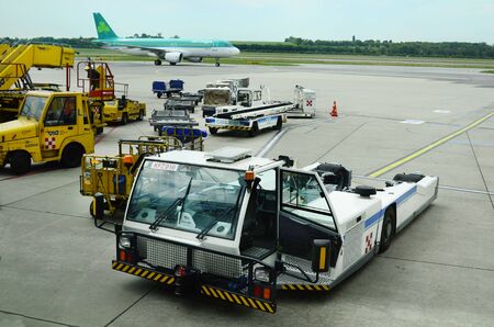 Schwechat, Austria - May 30th 2015: Aircraft and different technical equipment and vehicles on Vienna Airportのeditorial素材