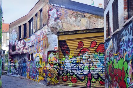 Ghent, Belgium - May 31st, 2011: Graffiti in Werregarenstraat, a narrow street where it is permitted for street art paintings and a tourist attraction in this cityのeditorial素材