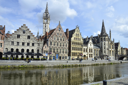Ghent, Belgium - May 31st 2011: Unidentified people and old buildings in the historical district Graslei, a Unesco world heritage siteのeditorial素材
