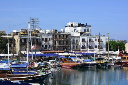 Kyrenia, Cyprus - October 17th 2015: Harbor of the city with different boats, hotels and restaurants, preferred place for touristsのeditorial素材