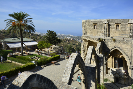 Kyrenia, Cyprus - October 17th 2015: Unidentified tourists in Bellapais Abbey with view to Kyrenia and mediterranean seaのeditorial素材