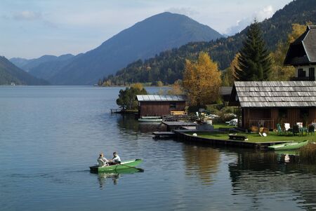 Weissensee, Austria - October 9th 2007: Unidentified people in rowing boat on lakeのeditorial素材