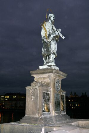 Prague, Czech Republic - Saint Nepomuk sculpture on Charles bridge by nightのeditorial素材
