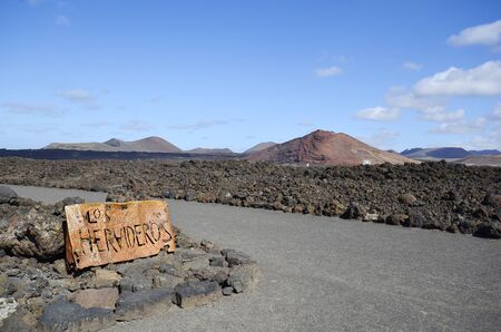Spain, sign to the natural spectacle and tourist attraction Los Hervideros on Lanzarote Spain, sign to the natural spectacle and tourist attraction Los Hervideros on Lanzarote