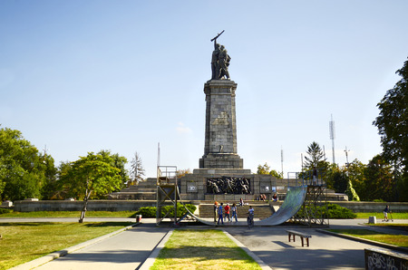 Sofia, Bulgaria - September 28th 2013: Unidentified people and skater ramp in front of the Soviet Army monument, it darstellt a soldier from the army, surrounded by a woman and one from Bulgaria.のeditorial素材