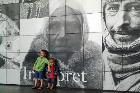 Adelaide, Australia - February 6th 2008: Two unidentified children in front of huge poster of Australian museum in the capital of South Australiaのeditorial素材