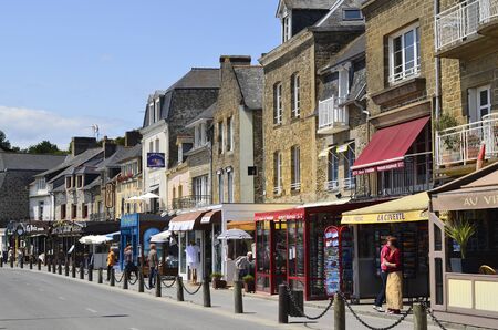 Cancale, Brittany, France - June 10th 2011: Unidentified people on promenade along harbor in the village in Brittany with different restaurants and shopsのeditorial素材