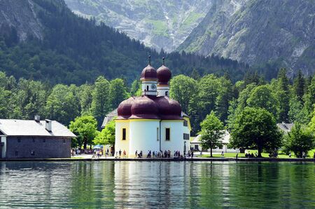 Berchtesgaden, Germany - June 12th 2015: Unidentified people around the church Saint Bartholomew on Koenigssee lakeのeditorial素材