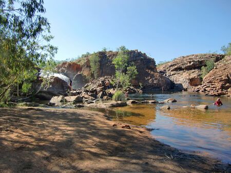 Australia, people enjoy the natural pools of Edith Falls in Nitmiluk nationalparkのeditorial素材