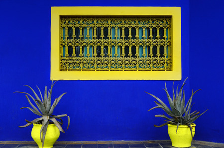 Marrakesh, Morocco - November 24th 2014: Colorful flower pot and window in Jardin Majorelle, former residence of fashion designer Yves Saint Laurent, now open for publicのeditorial素材