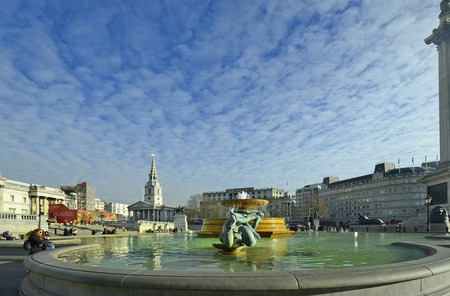 London, United Kingdom - January 19th 2016: Unidentified people, fountain and church St.Martin-in-the-Fields on Trafalgar Squareのeditorial素材