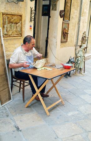 Lecce, Italy - June 14th 2007: Artisan produce goods made with papier-mache for the traditional events in Puglia,のeditorial素材