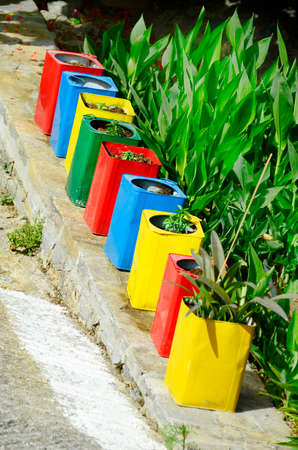 Greece, colorful cans as flower pot on Crete islandのeditorial素材