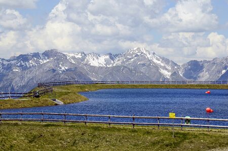 Austria, Tirol, water reservoir for artificial snowblowers in winter on Hochzeiger mountainの写真素材