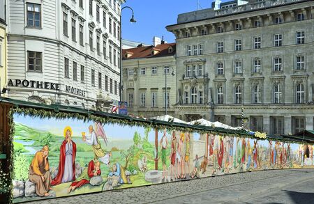 Vienna, Austria - March 27th 2016: Religious wall painting on traditional Easter market on Freyung squareのeditorial素材
