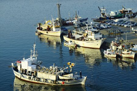 Kavala, Greece - September 11th 2014: Unidentified people on fishing boats in the harbor of the city in Eastmacedoniaのeditorial素材