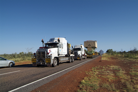 Australia - April 21, 2010: Extry wide heavy-duty transport with two tractor units and one behind