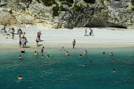 Zakynthos, Greece - May 25, 2016: Unidentified people enjoy holiday on a beach of the island in...