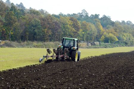 Hornstein, Austria - October 28, 2016: Unidentified farmer plowing field with tractorのeditorial素材