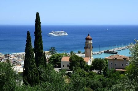 Zakynthos, Greece - May 26, 2016: Cruising ship on Ionian sea and aerial view to harbor in the capital of the island in Ionian seaの写真素材