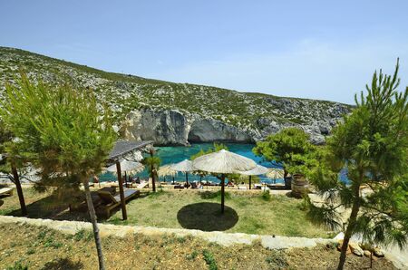 Zakynthos, Greece - May 30, 2016: Unidentified people rest in Porto Limionas, preferred place for swimming and relaxingのeditorial素材