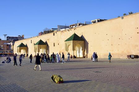 Meknes, Morocco - November 19th 2014: Unidentified people and street performer on place el-Hedim...