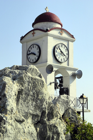 Greece, bell and clock tower of a church in Skiathos