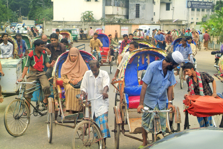 Dhaka, Bangladesh - September 17, 2007: Unidentified people in rickshaws - a traditional kind of transport in the capitalのeditorial素材