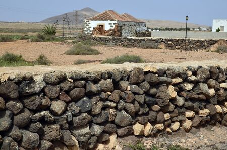 Spain, Canary Island, Fuerteventura, La Oliva, traditional wall and fenz built with stonesの写真素材
