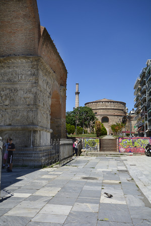 Thessaloniki, Greece - June 09, 2017: Unidentified people, ancient buildings Rotunda with minaret, former mosque and church and arch of Galerius, Unesco World Heritage site in the city in Central Macedoniaのeditorial素材