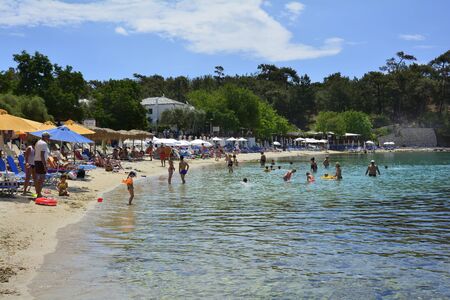 Aliki, Greece - June 10, 2017: Unidentified people on Aliki beach, preferred travel destination on Thassos islandのeditorial素材