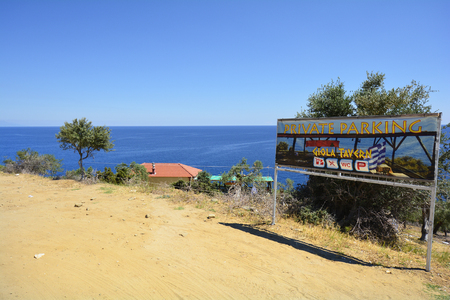 Thassos Island, Greece - June 10, 2017: Signpost to tavern on preferred natural rock pool Giola on the coast on Aegean seaのeditorial素材