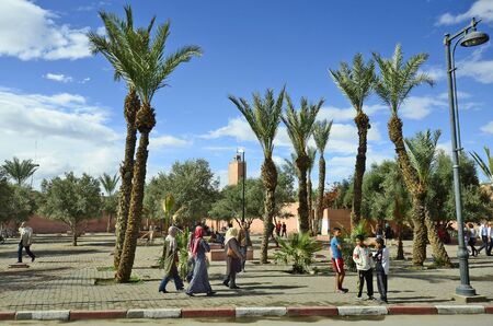 Marrakesh, Morocco - November 22nd 2014: Unidentified people and woman with headscarf , a traditional clothing in muslim countriesのeditorial素材
