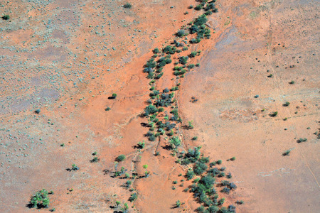 Australia, NT, arerial view from outback with dries up river around Alice Springsの写真素材