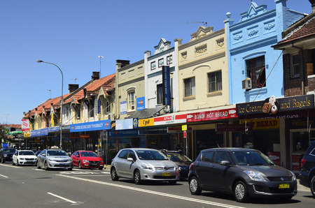 Sydney, NSW, Australia - October 31, 2017: Colorful facade with homes, shops and traffic in Bondi districtのeditorial素材