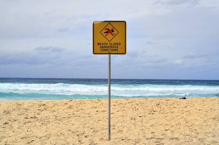 Australia, Sydney, warning sign for closed beach because of weather conditionsの写真素材