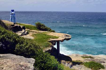Sydney, NSW, Australia - October 31,2017: Sculpture by the sea - an outdoor exhibtion along the coast in Bondi, artwork named Under One Sky by Stephen Marr on coastのeditorial素材
