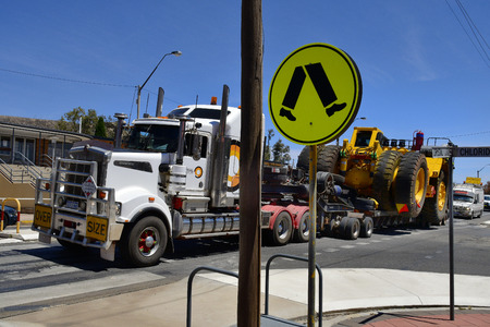 Broken Hill, Victoria, Australia - November 10, 2017: Abnormal wide load on truck usually named road train carry a mining vehicle in the frontier city in Australians outbackのeditorial素材