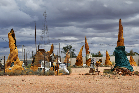 Coober Pedy, SA, Australia - November 14, 2017: Sculptures and old film set equipment on public parking area in the village in South Australiaの写真素材
