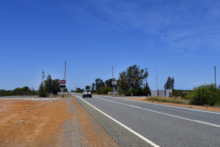 Australia, railway crossing on Brand  highway in Western Australiaの写真素材