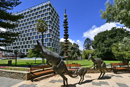 Perth, WA, Australia - November 28, 2017: Sculpture with kangaroos and column with collection of minerals in public Stirling gardens in front of Council Houseのeditorial素材