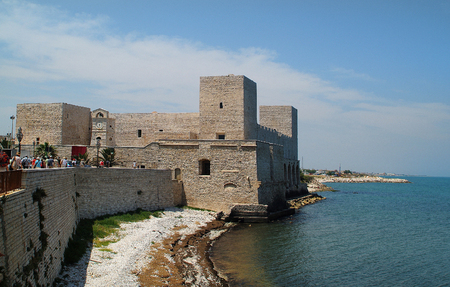 Trani, Puglia, Italy - June 15, 2007: Group of tourists by sightseeing of the old castle in the city on Adriatic seaのeditorial素材