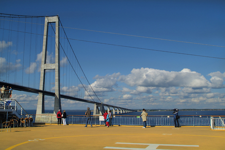 Fuenen, Denmark - June 05, 2009: Unidentified tourist on ferry ship crossing bridge over big belt - junction between Fuenen and Seelandのeditorial素材