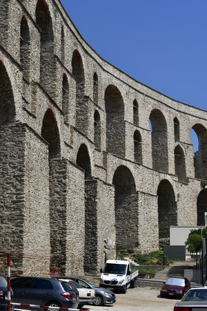 Kavala, Greece - June 11, 2018: Medieval aqueduct Kamares in the city in East Macedoniaのeditorial素材