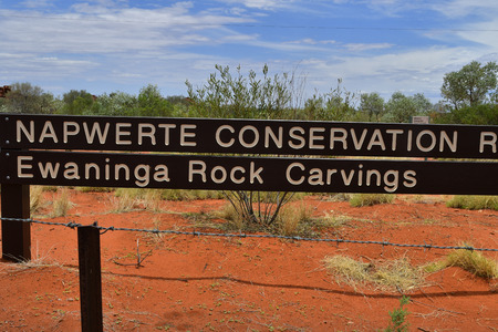 Australia, NT, sign for public Ewaninga Conservation Reserve, area with prehistoric engravings and Aborigines historical site,のeditorial素材