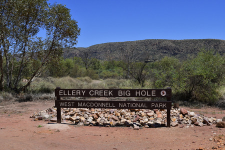 Alice Springs, NT, Australia - November 17, 2017: Bord at Ellery Creek Big Hole, waterhole and lake for swimming in McDonnell Rangeのeditorial素材
