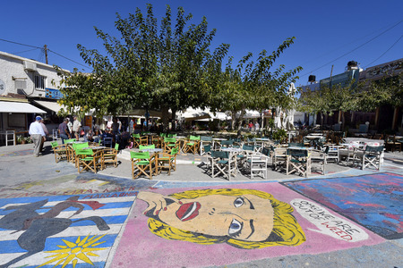 Matala, Greece - October 07, 2018: Unidentified people, different restaurants, shops and street paintings on main square of the town in the south of Creteのeditorial素材