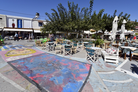 Matala, Greece - October 07, 2018: Unidentified people, different restaurants, shops and street paintings on main square in the town in the south of Creteのeditorial素材