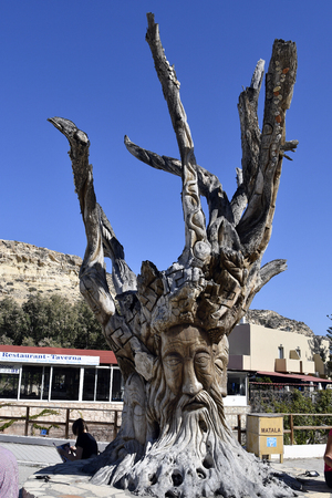 Matala, Greece - October 07, 2018: Fantastically carved tree trunk in the village on the south coast of Creteのeditorial素材
